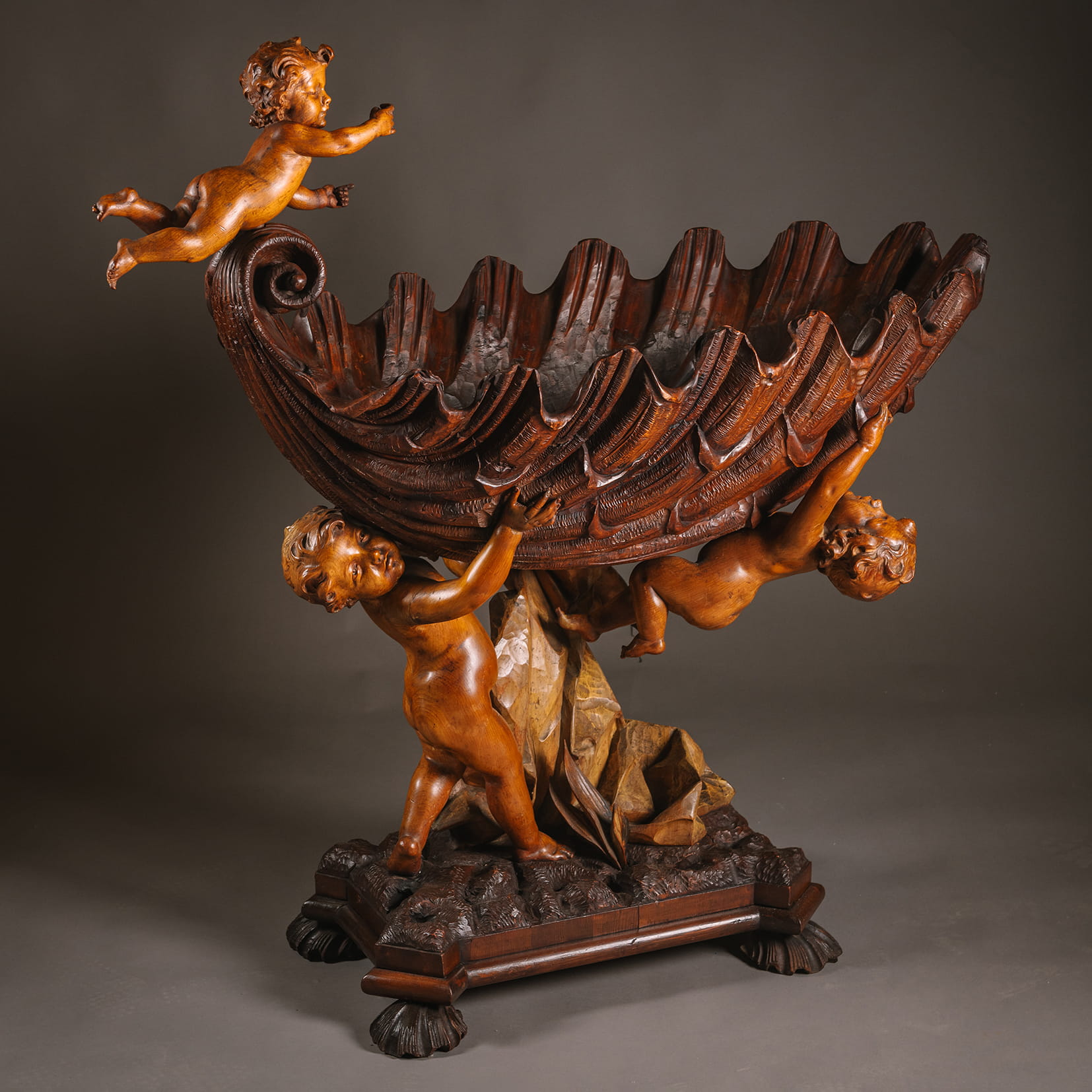 A Baroque Style Sculptural Carved Wood Cradle