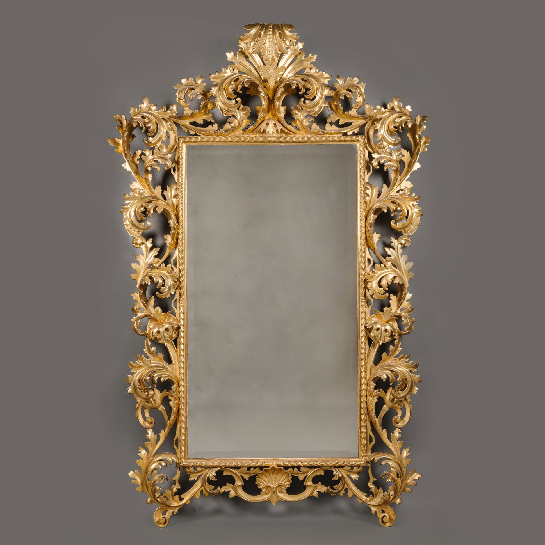 A Large and Elaborately Carved Florentine Giltwood Mirror