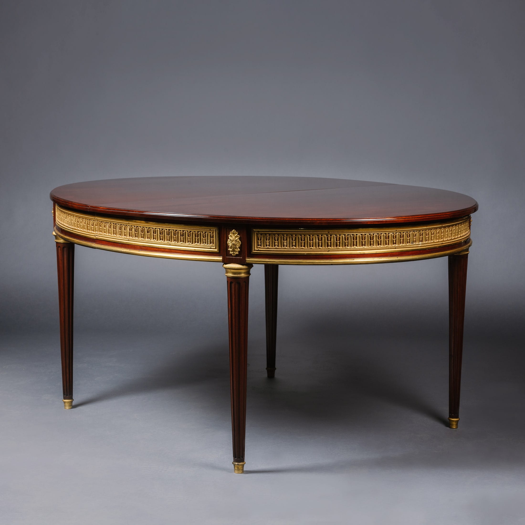 A Fine Louis XVI Style Gilt-Bronze Mounted Mahogany Dining Suite - Image 3