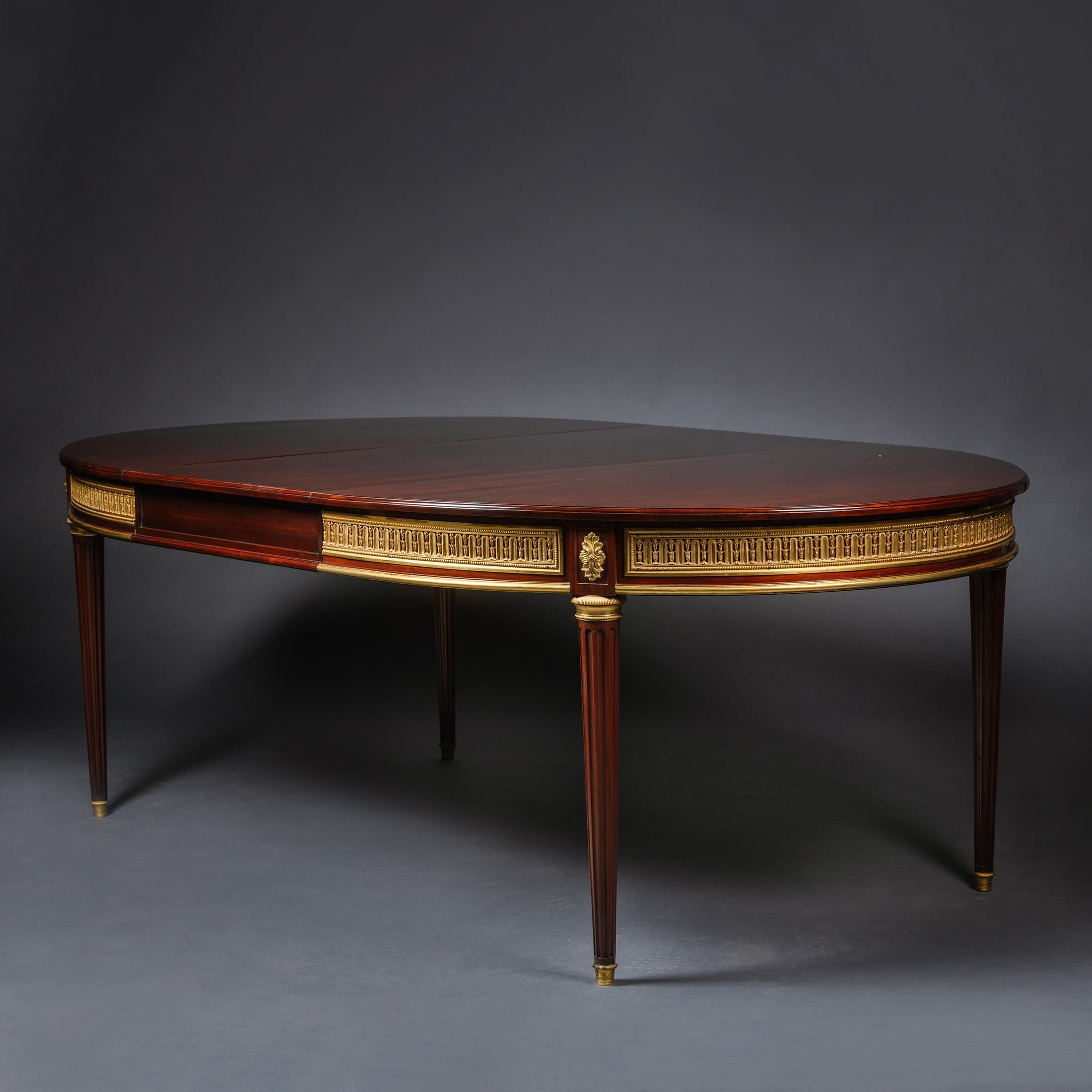 A Fine Louis XVI Style Gilt-Bronze Mounted Mahogany Dining Suite - Image 4