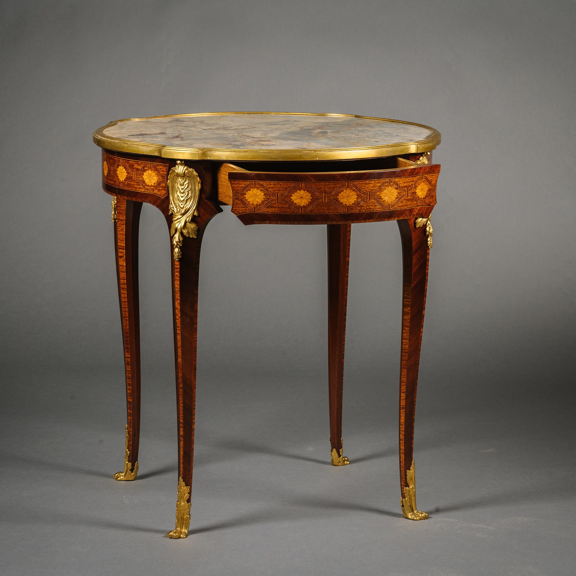 A Louis XV Style Gilt-Bronze Mounted Mahogany and Parquetry Occasional Table - Image 2
