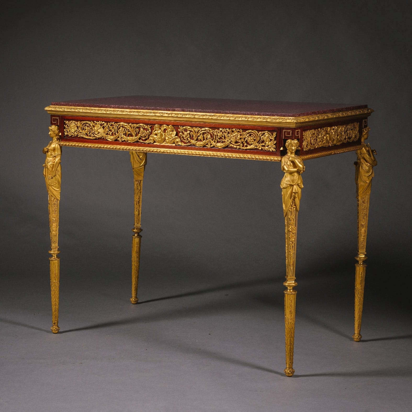 'Table des Arts' - An Important Gilt-Bronze, Mahogany And Porphyry Table