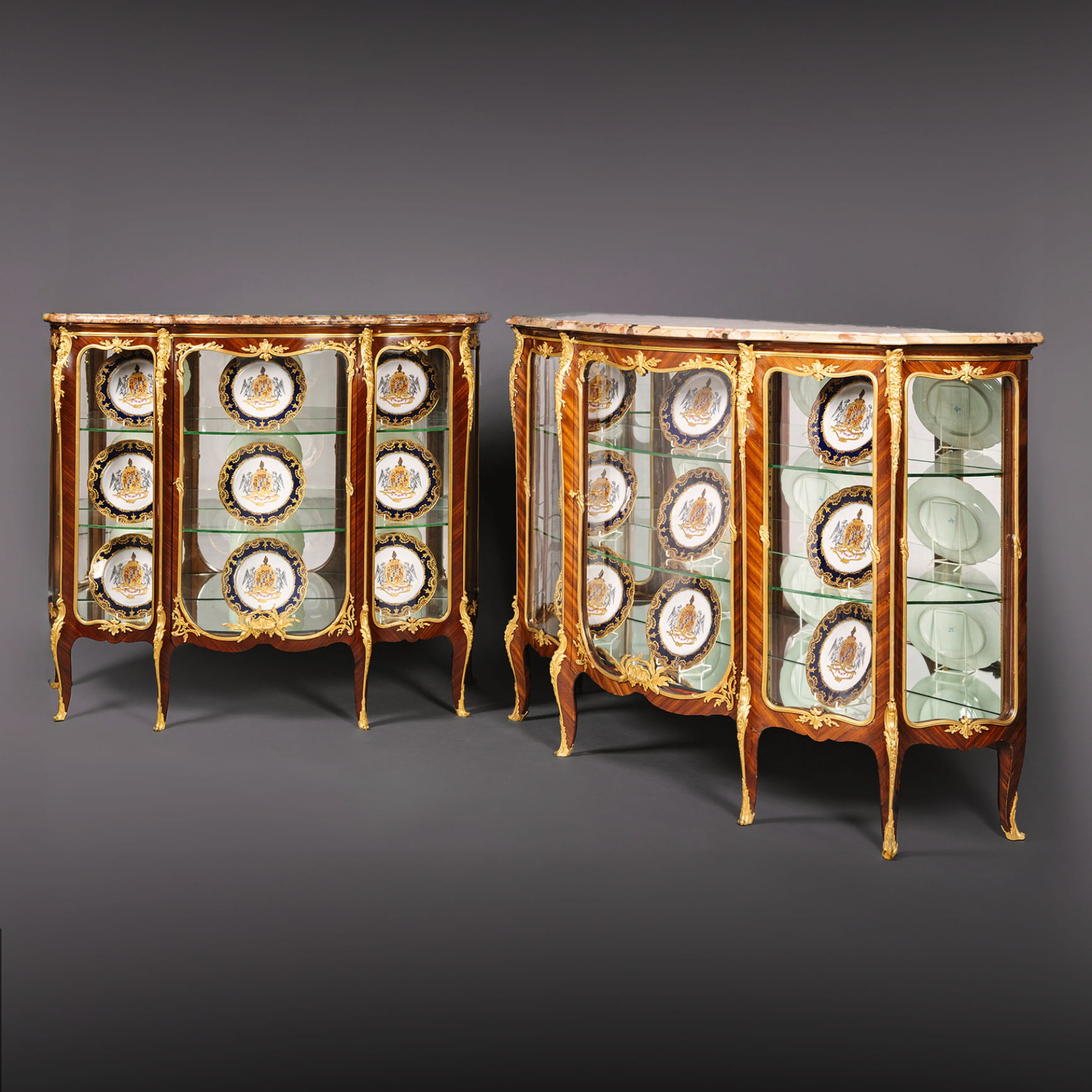 A Near Pair of Belle Epoque Gilt-Bronze Mounted Mahogany Vitrine Cabinets