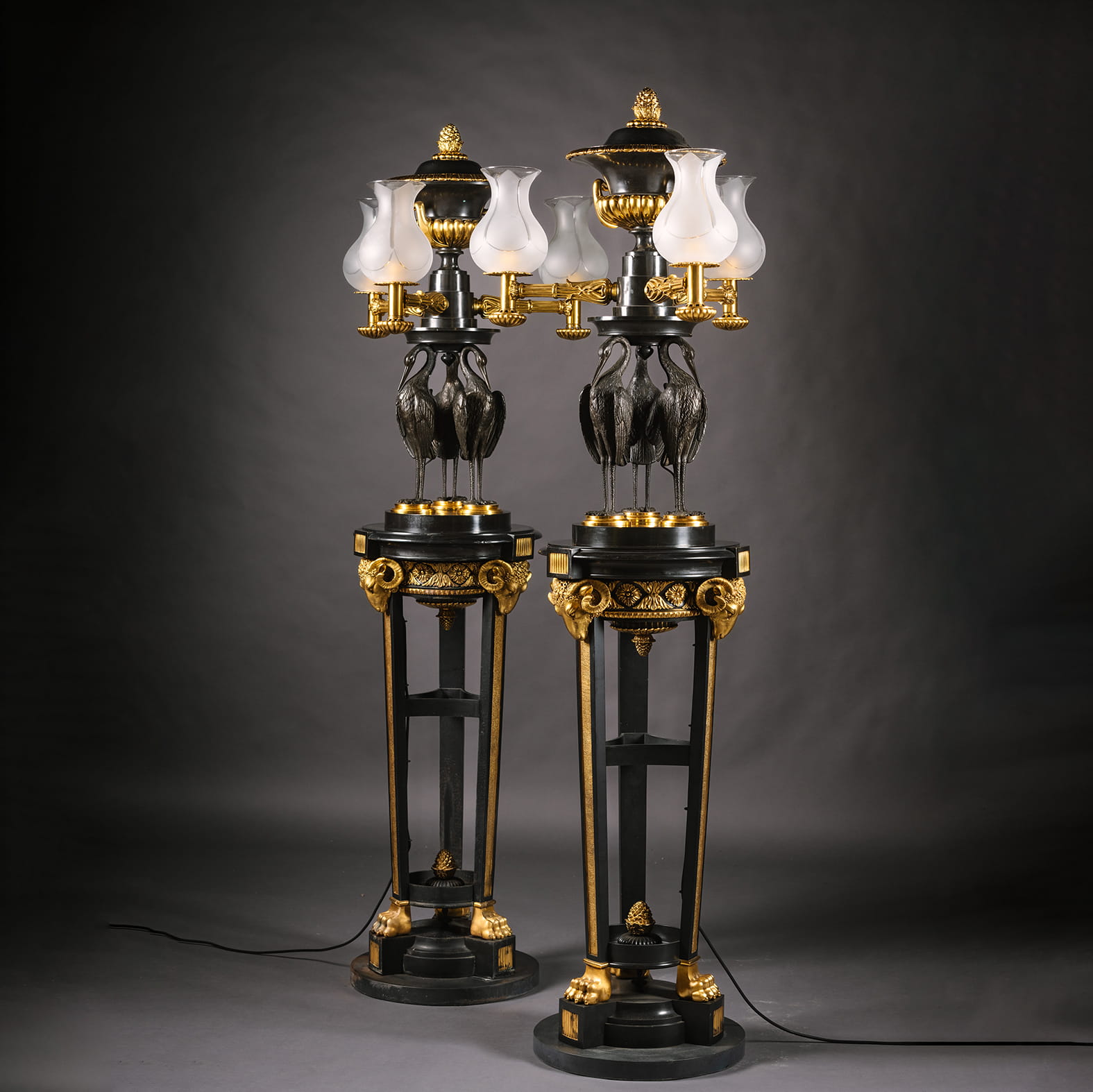 A Pair of Regency Style Gilt and Patinated Bronze Floor Lamps or 'Torchères'