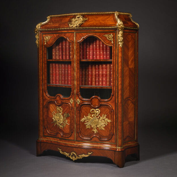 Regence style gilt-bronze mounted parquetry veneered bookcase by Maison Beurdeley, Paris circa 1860.