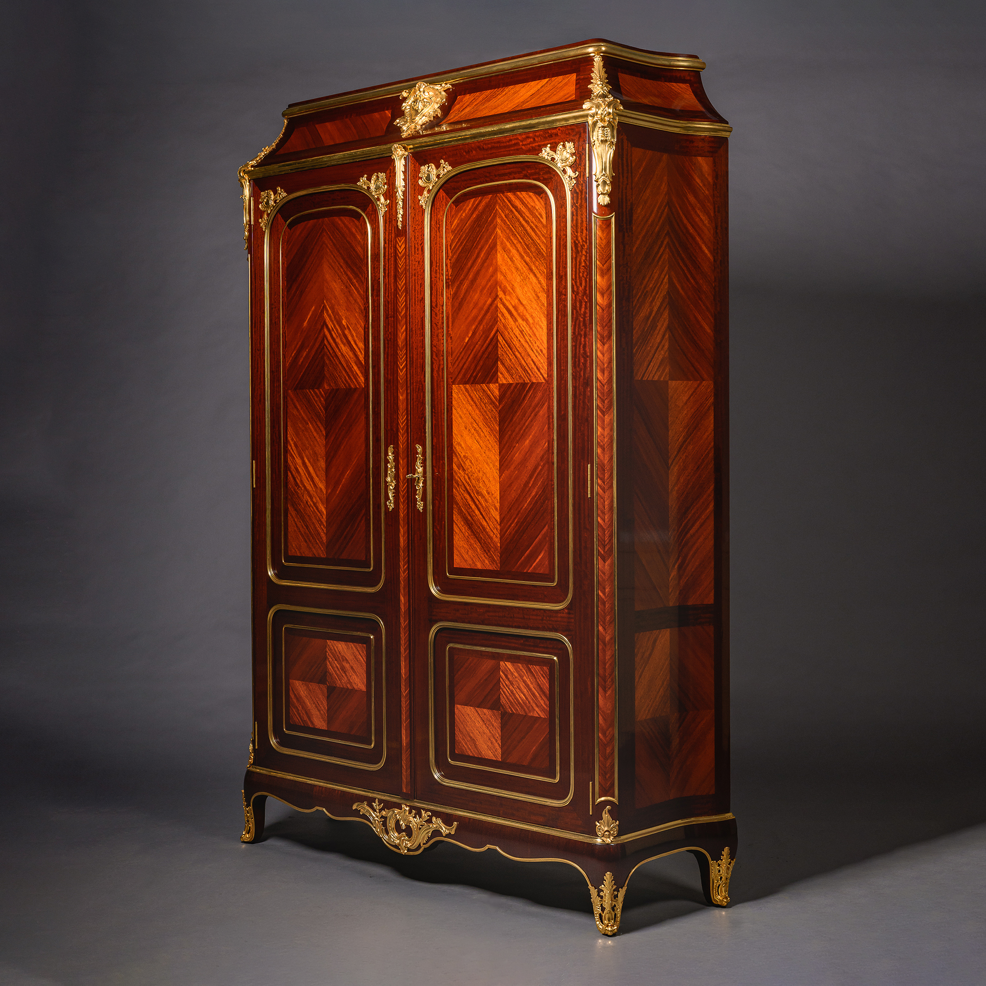 An imposing late 19th century armoire inspired by early French Régence design.