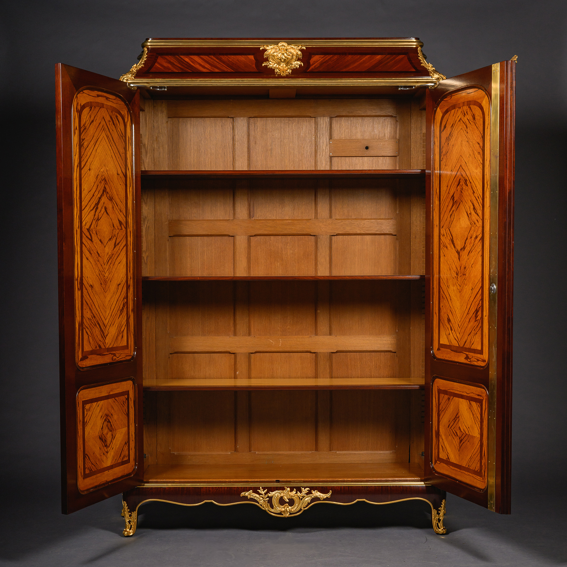 Interior of a Durand Paris armoire with adjustable shelves and zebrawood veneered doors.