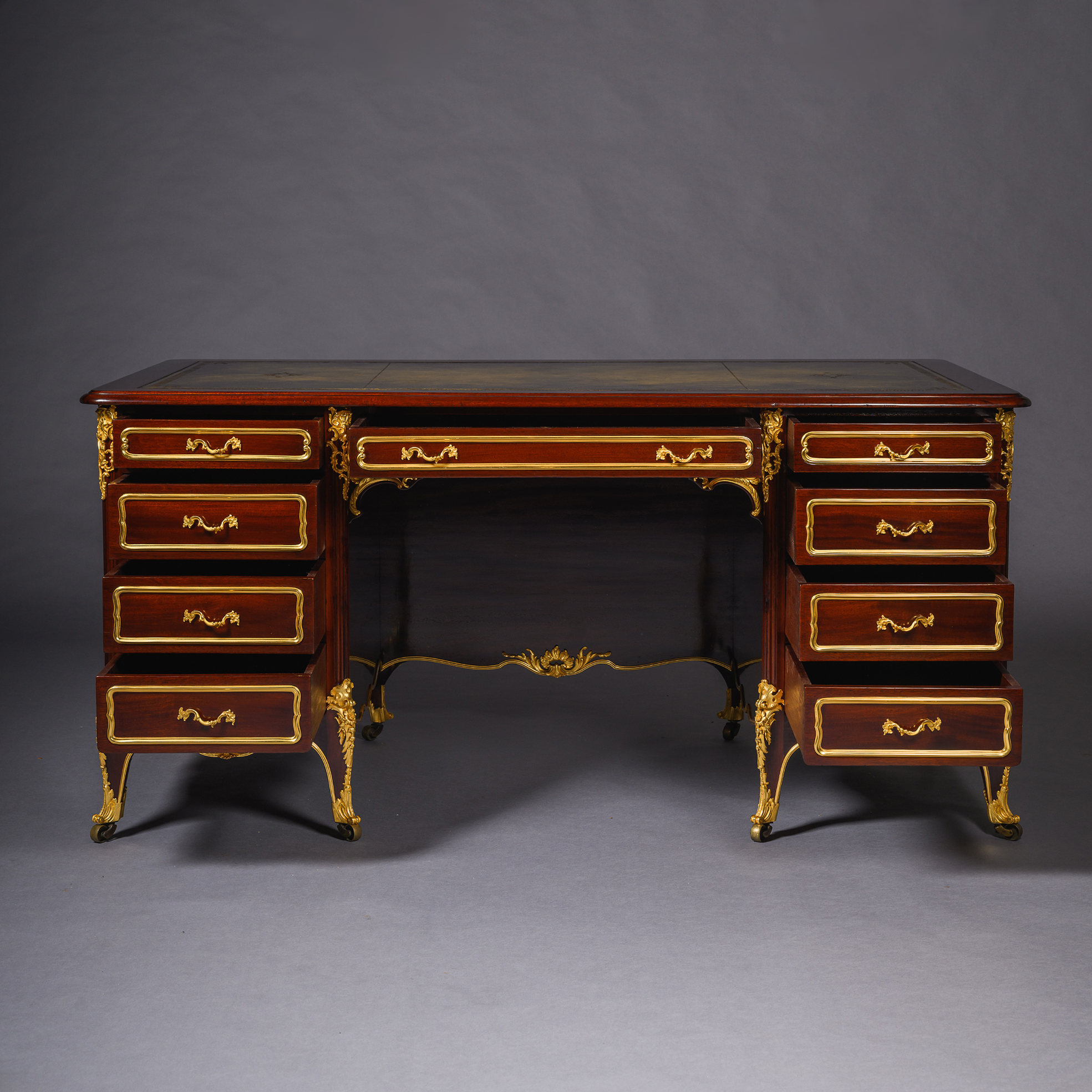 Nineteenth-century French bureau à caissons with green leather writing surface