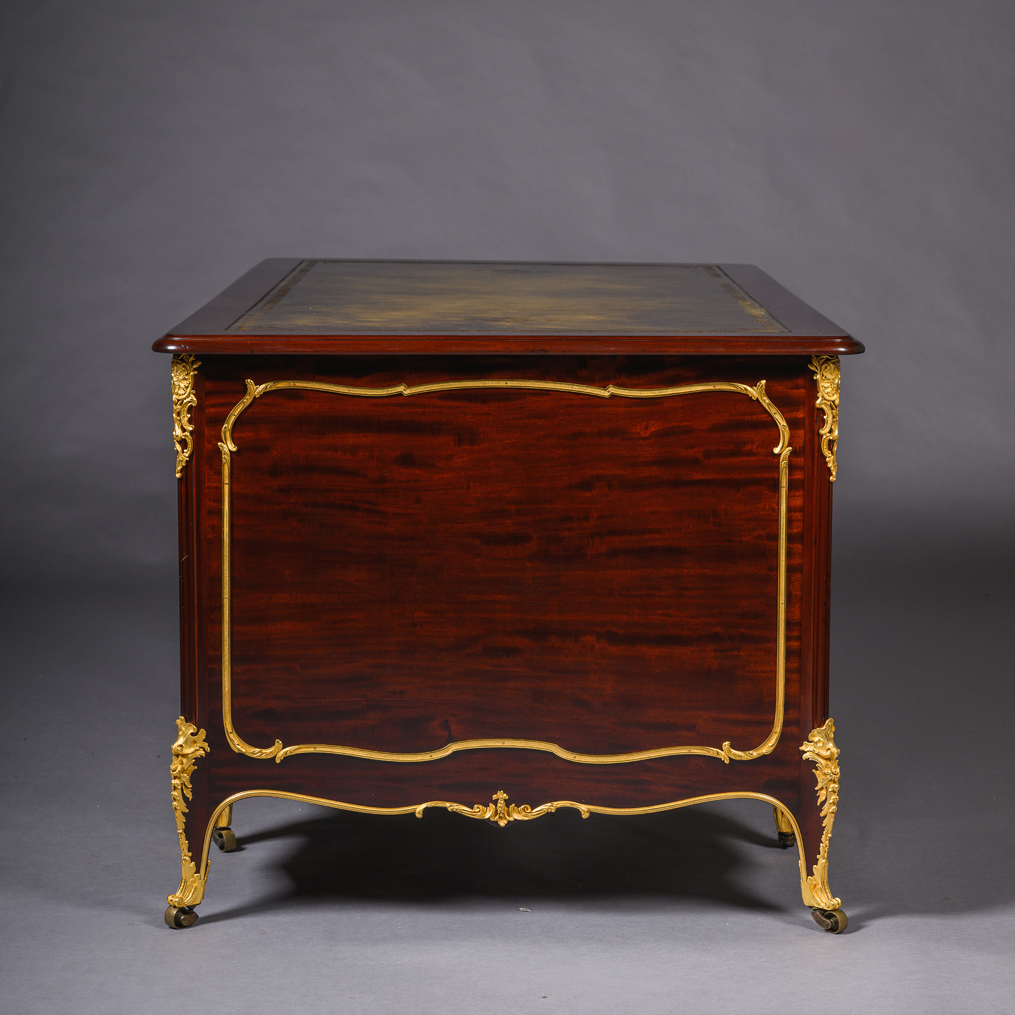Gilt-bronze mounted side panel of Beurdeley desk