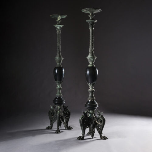Pair of Napoleon III Neo-Grec bronze and black marble torchères