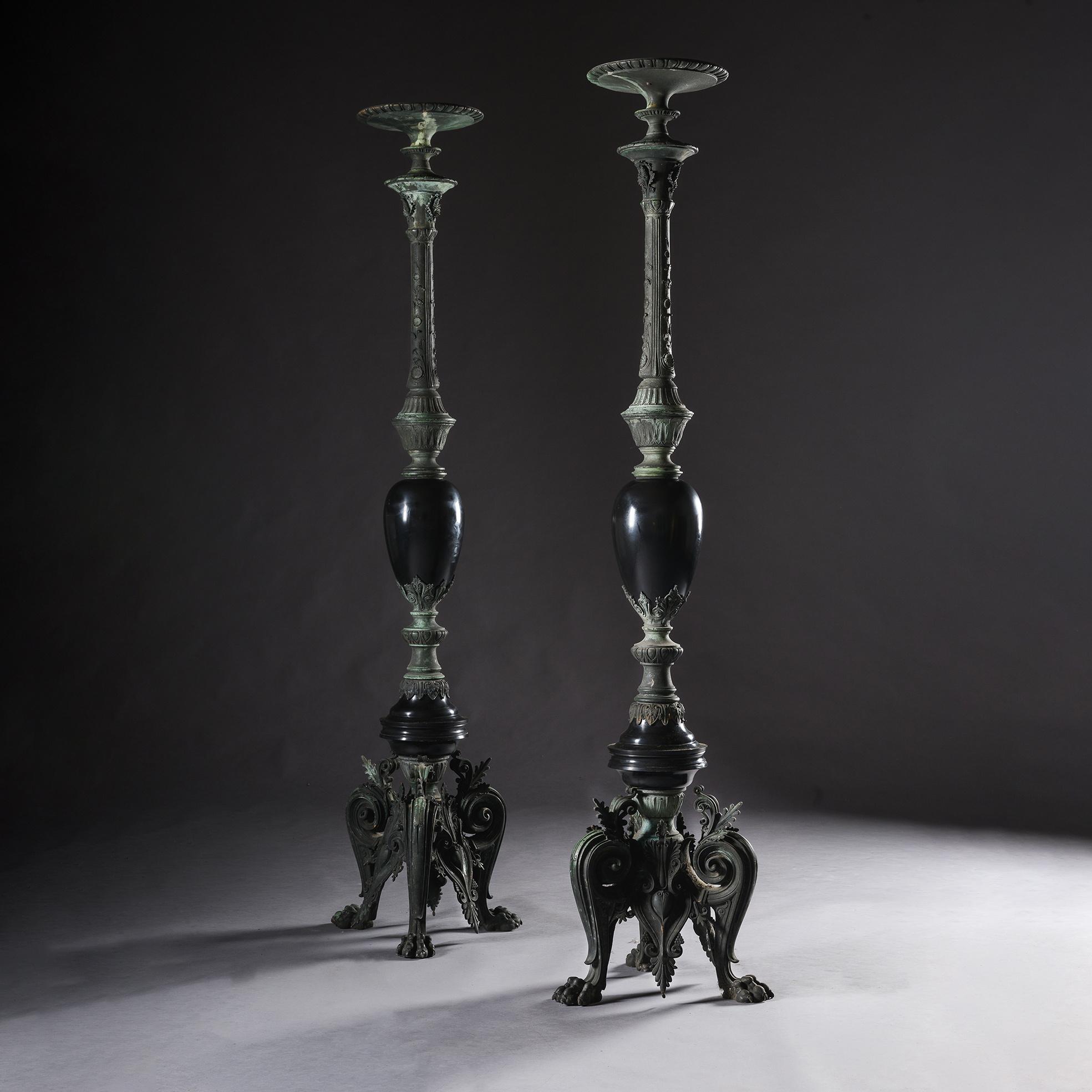 Pair of Napoleon III Neo-Grec bronze and black marble torchères