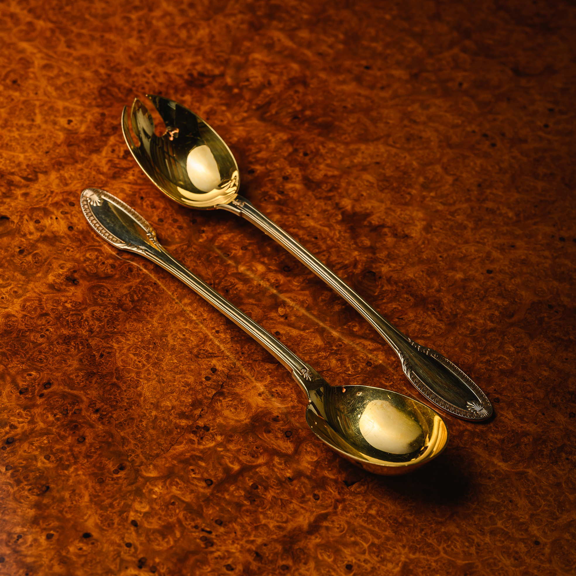Puiforcat Paris Percier pattern silver-gilt salad serving spoons, delicately modelled with balanced proportions and refined classical ornamentation
