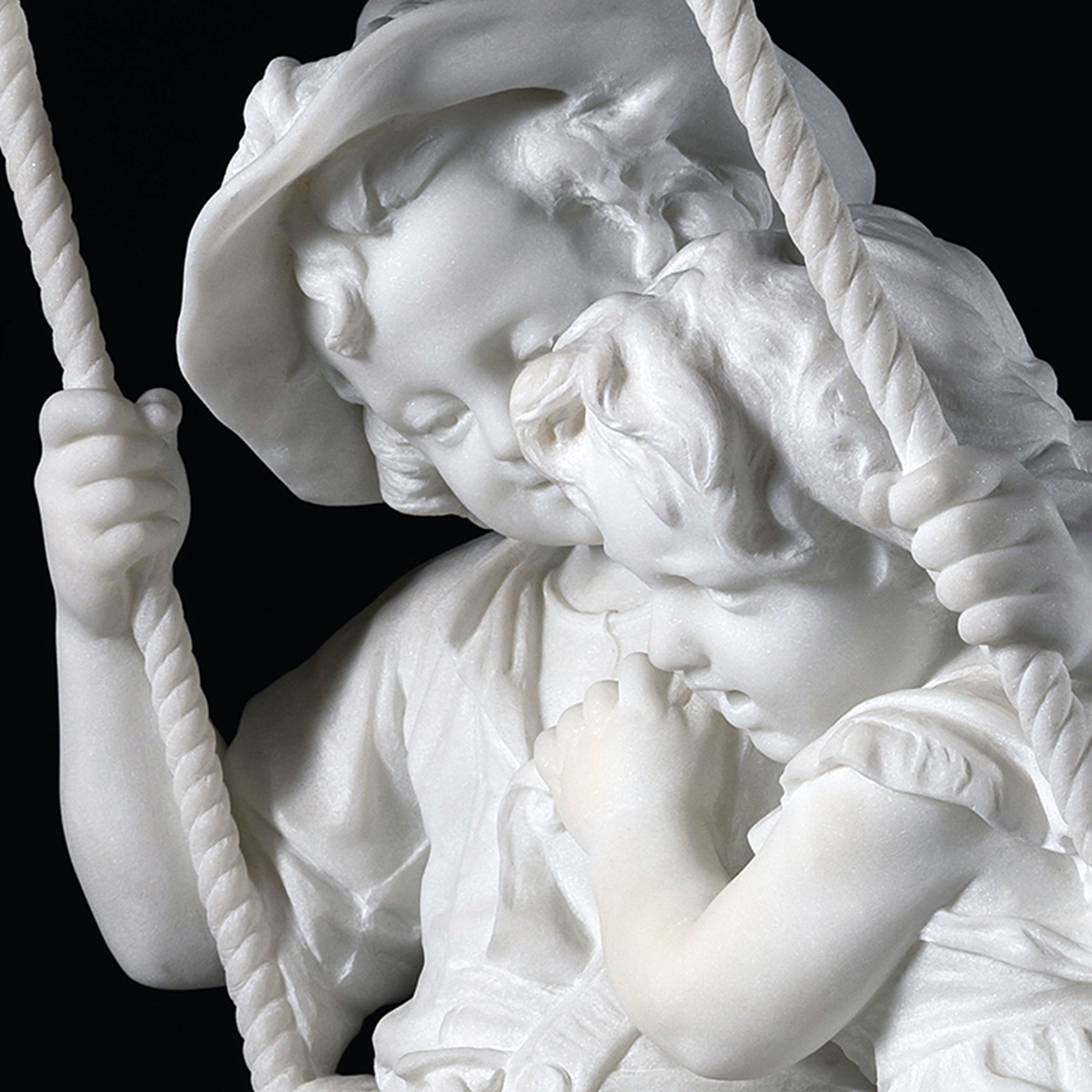 Close-up of expressive faces and finely carved drapery on Carrara marble children by Alessandro Lazzerini.