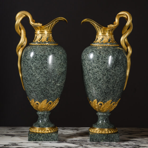 Pair of Louis XVI style gilt-bronze mounted green granite ewers by Henry Dasson, Paris, circa 1880, with entwined serpent handles.