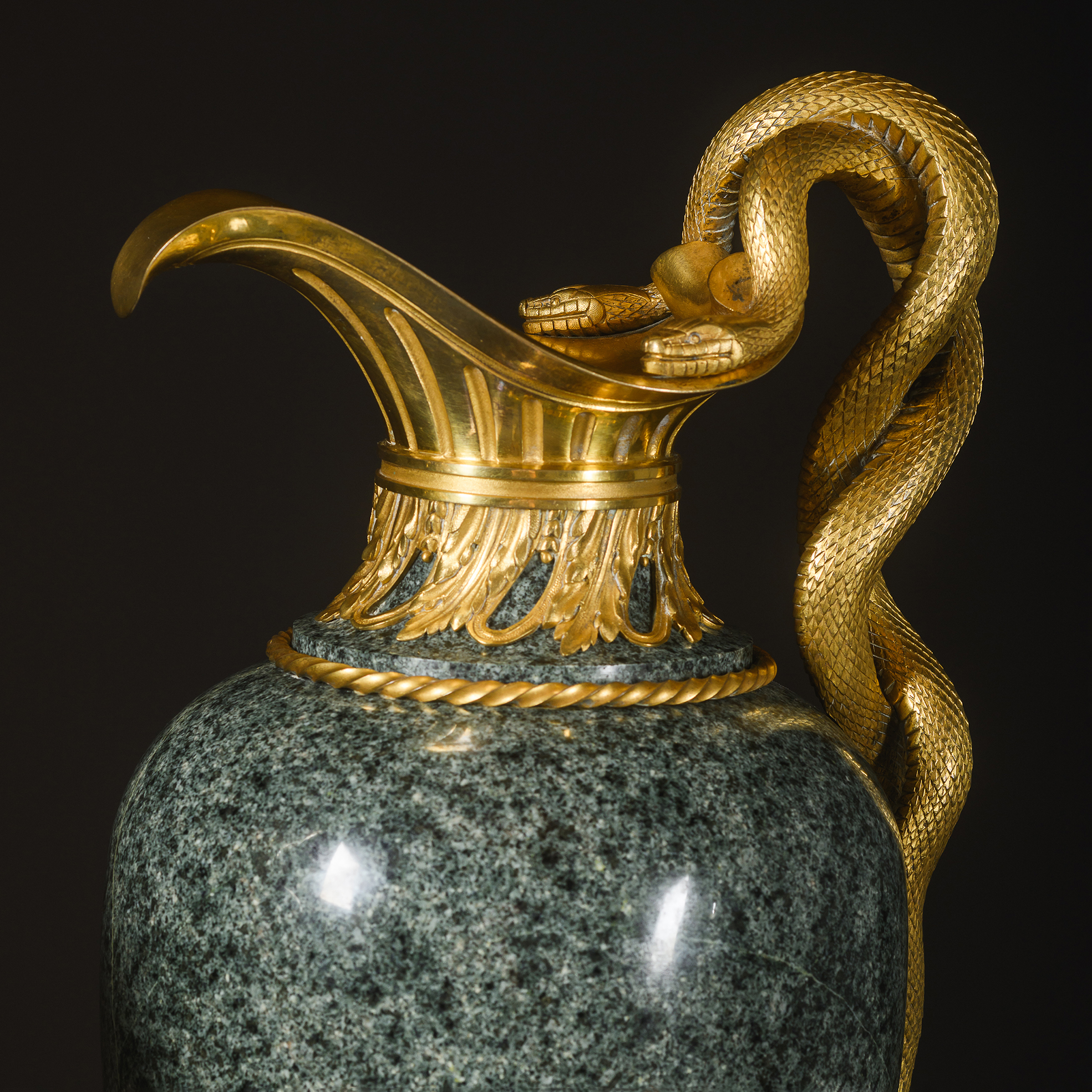 Finely chased gilt-bronze spout and acanthus leaf collar on a green granite ewer by Henry Dasson.