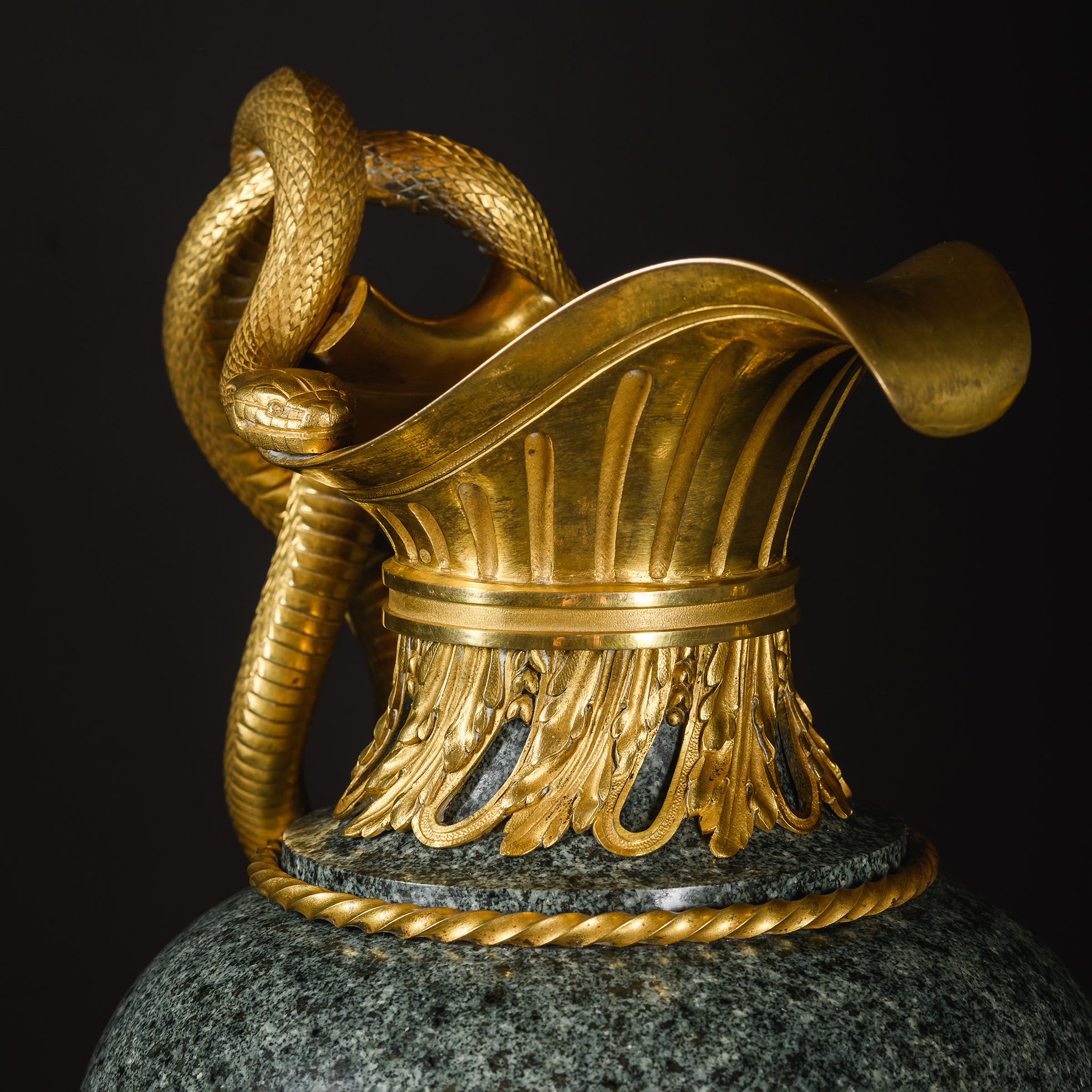 gilt-bronze spout and collar on a green granite ewer by Henry Dasson.
