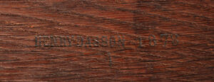 HENRY DASSON maker's stamp impressed into the oak carcass of a piece of furniture