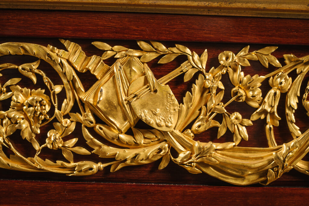 Henry Dasson Table des Arts, a gilt-bronze, mahogany and porphyry exhibition table dated 1889