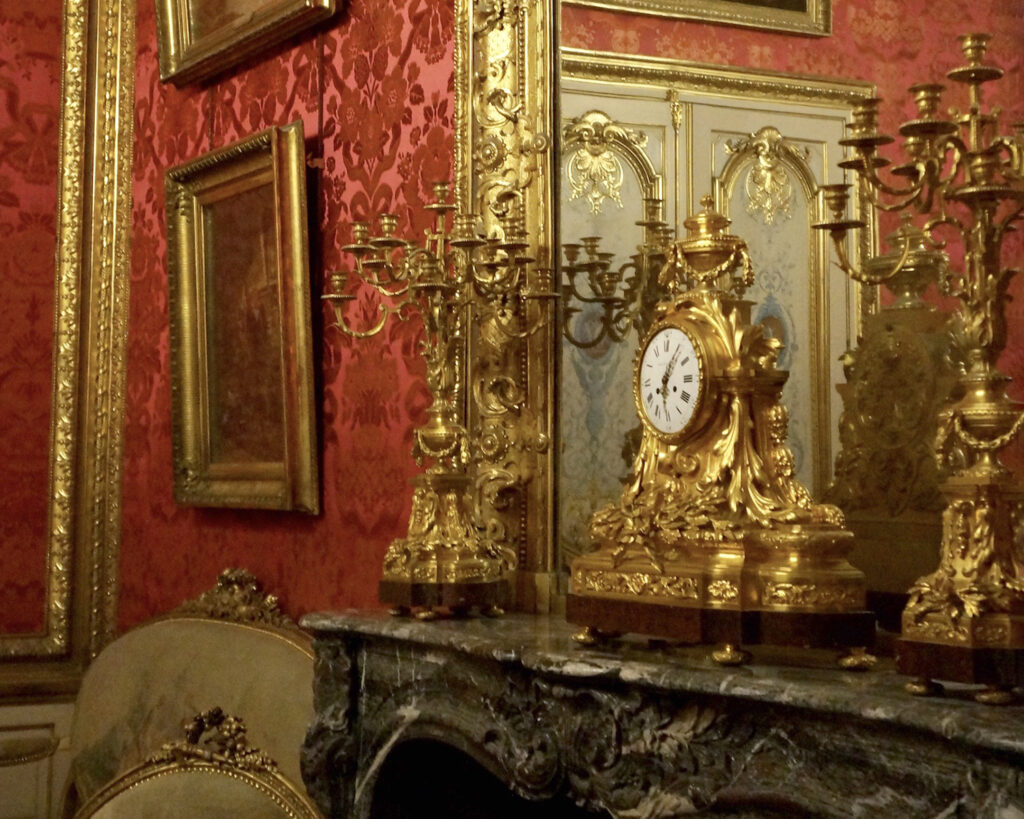 A mantlepiece with clock garniture, apartments Napoleon III, Louvre