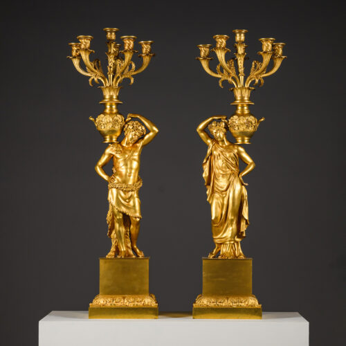 A pair of large Charles X period gilt-bronze figural six-light candelabra, attributed to Pierre-Philippe Thomire, France, circa 1830.