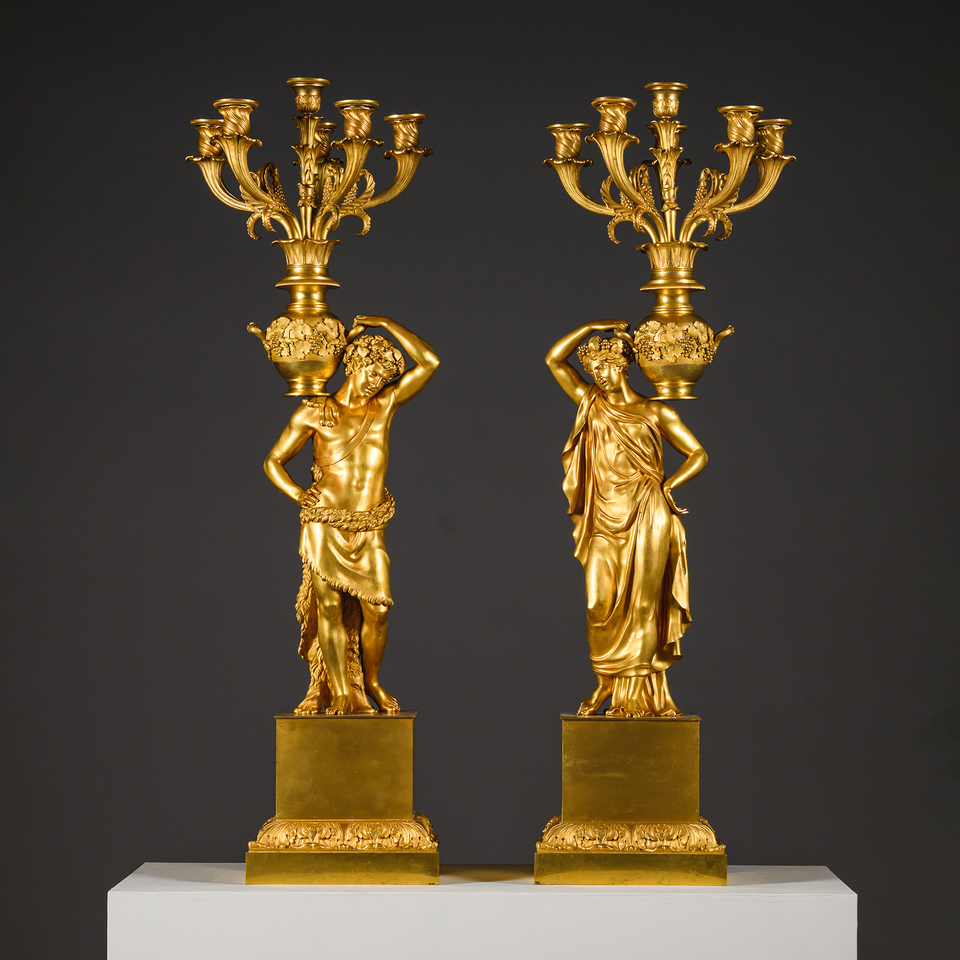 A pair of large Charles X period gilt-bronze figural six-light candelabra, attributed to Pierre-Philippe Thomire, France, circa 1830.