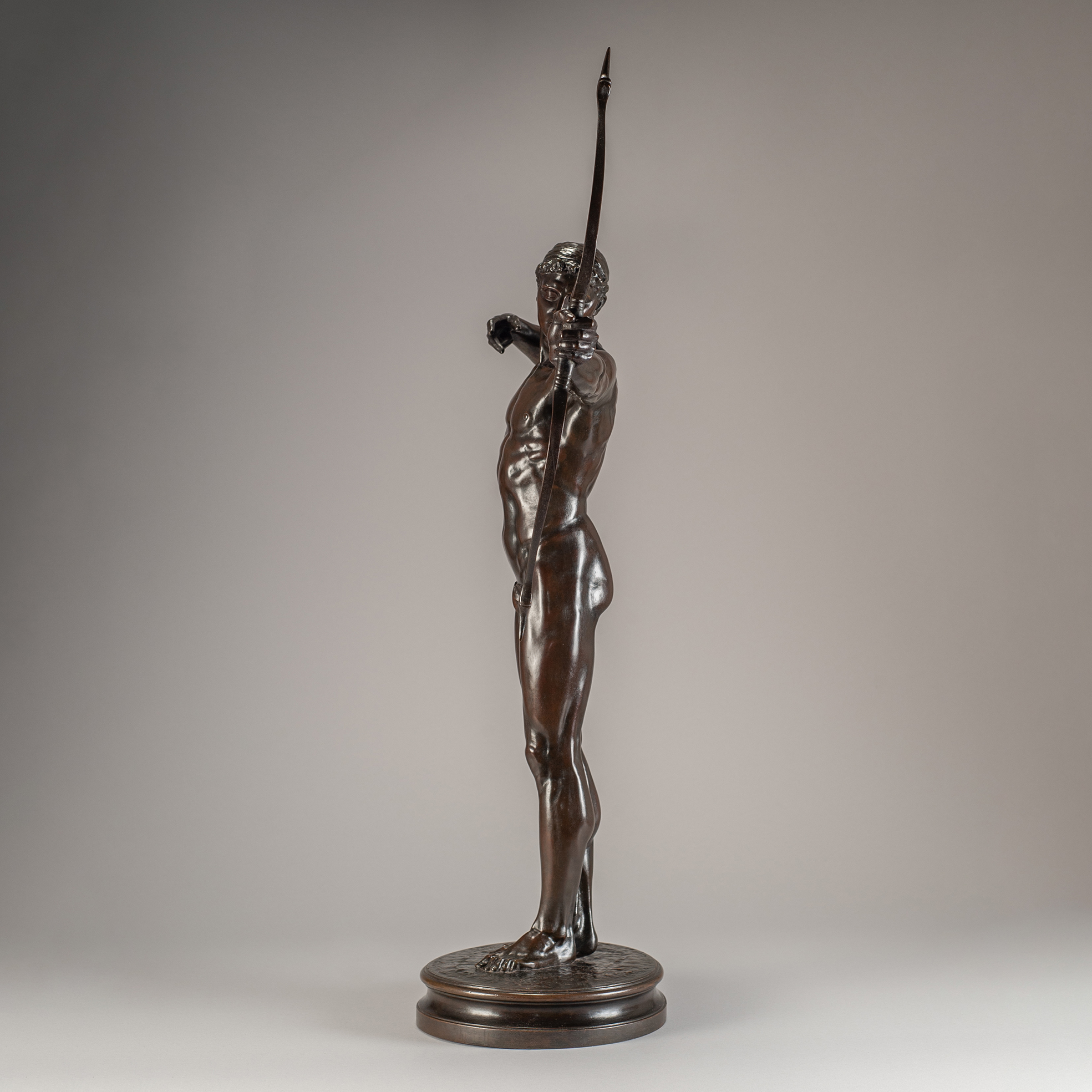 Side view of Hamo Thornycroft’s bronze sculpture Teucer, depicting the Homeric hero in a tense archer’s pose.