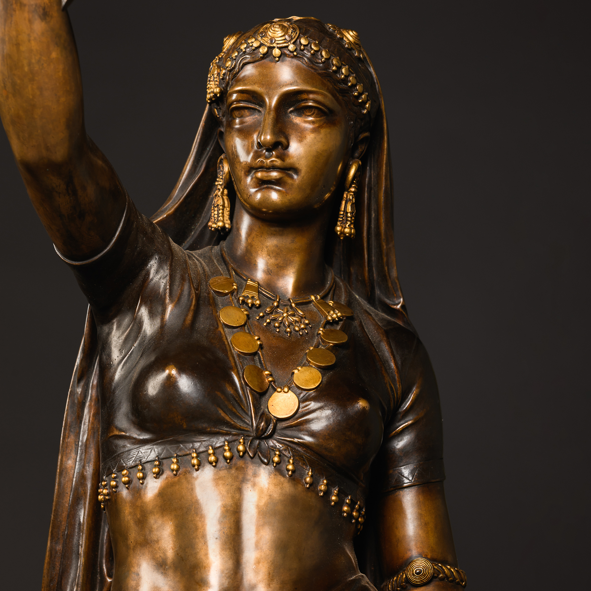 Close-up of the richly coloured patinated-bronze surface of Guillemin’s ‘Femme Indienne’, characteristic of his Orientalist sculpture.