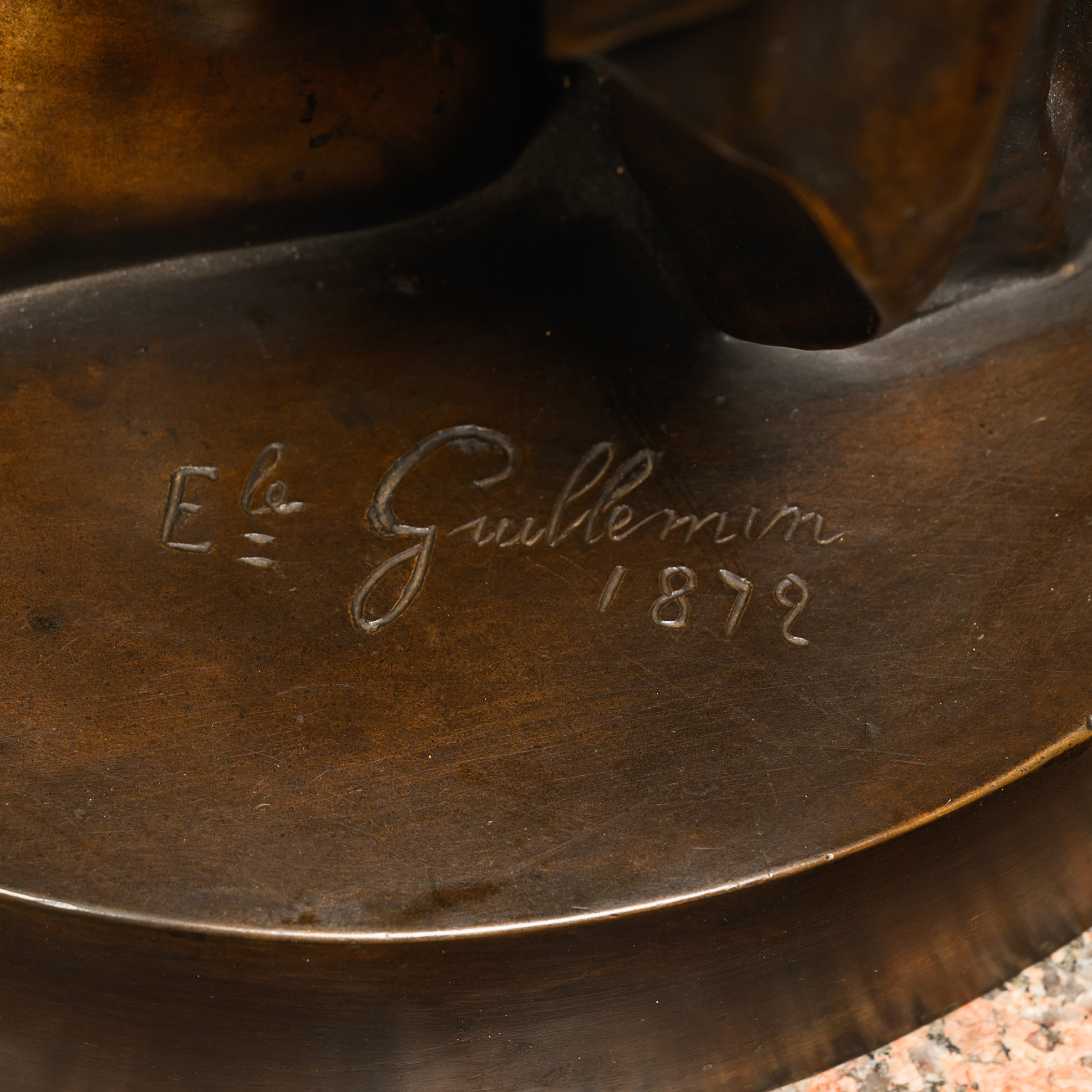 Close-up of the sculptor’s signature ‘Ele. Guillemin 1872’ on the base of the patinated-bronze figure.