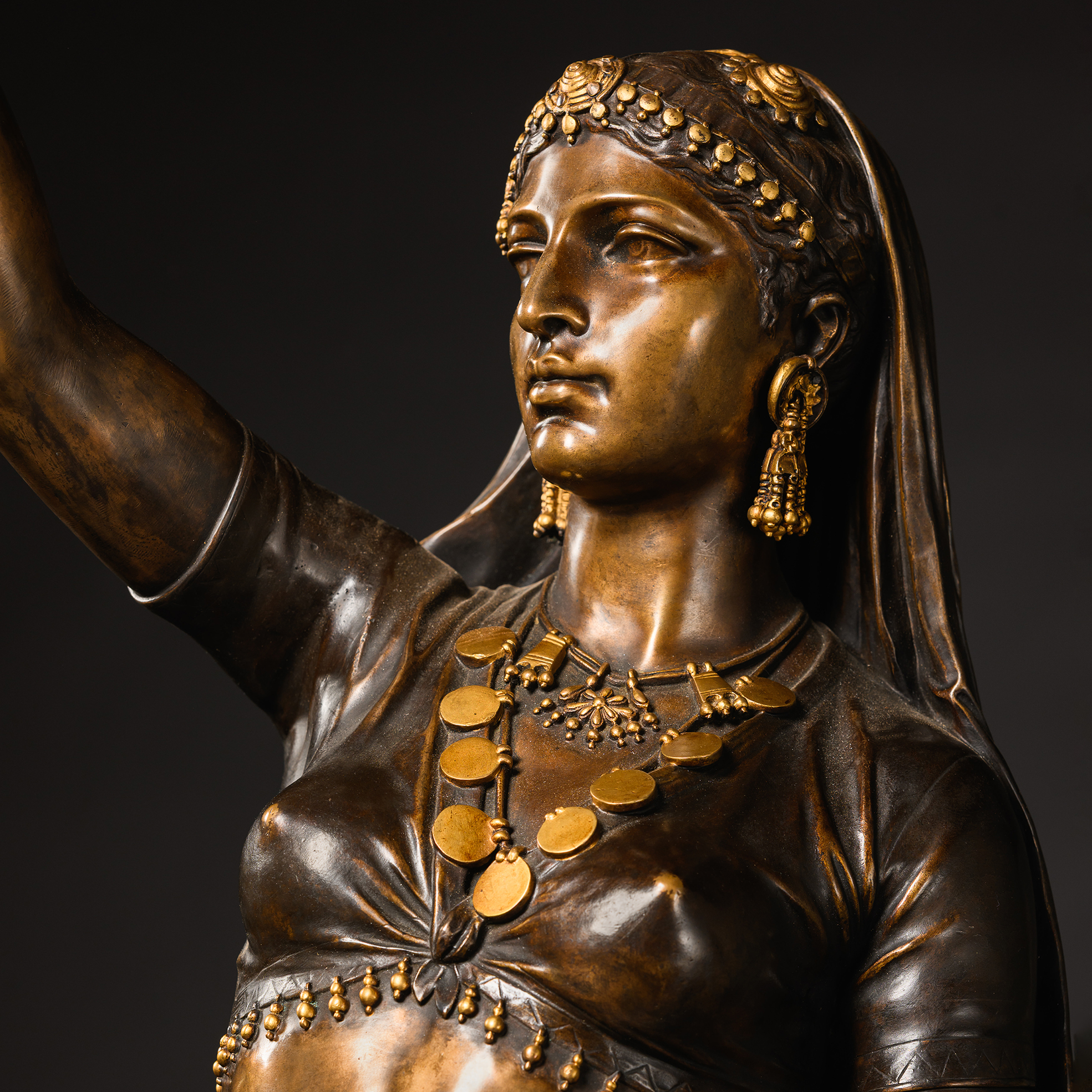 Detail of the Orientalist female figure in Émile Guillemin’s ‘Femme Indienne’, displaying the sculptor’s elaborate modelling and coloured bronze patination.