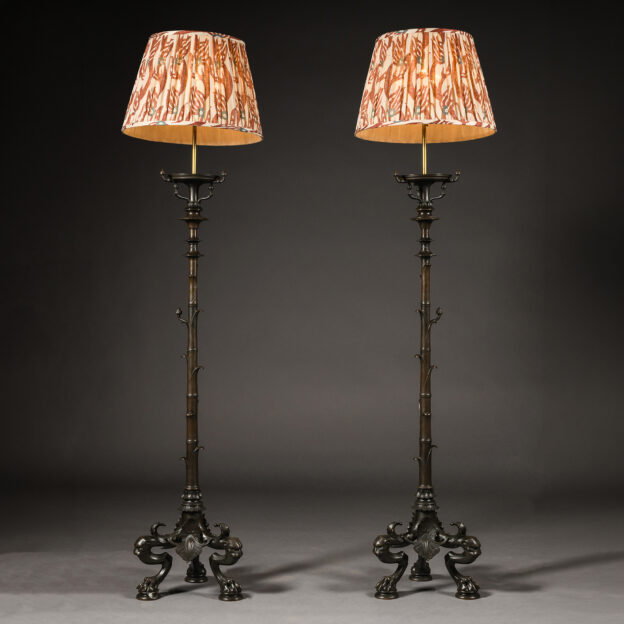 A pair of Neo-Pompeiian patinated bronze torchères fitted as standard lamps, attributed to Maison Barbedienne, Paris, circa 1860.