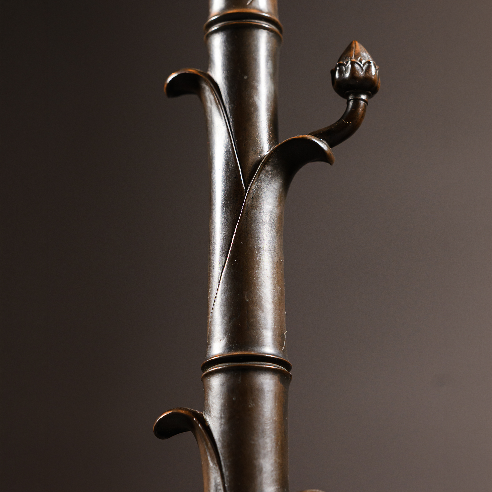 ring-turned bronze shaft and scrolling tendril ornament of a Neo-Pompeiian torchère